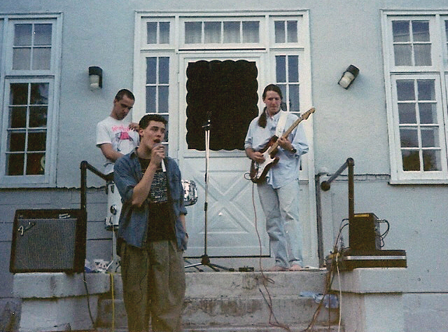 Band performing on house stoop