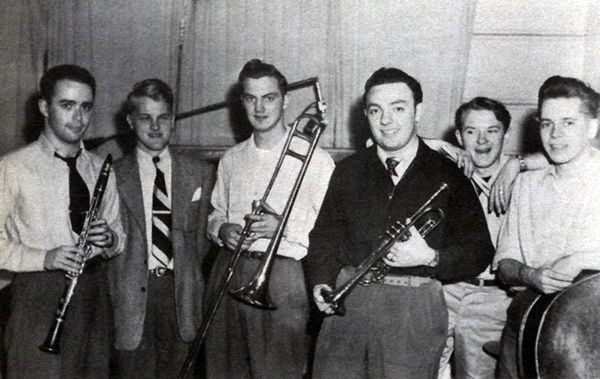 Group photo of the band holding instruments
