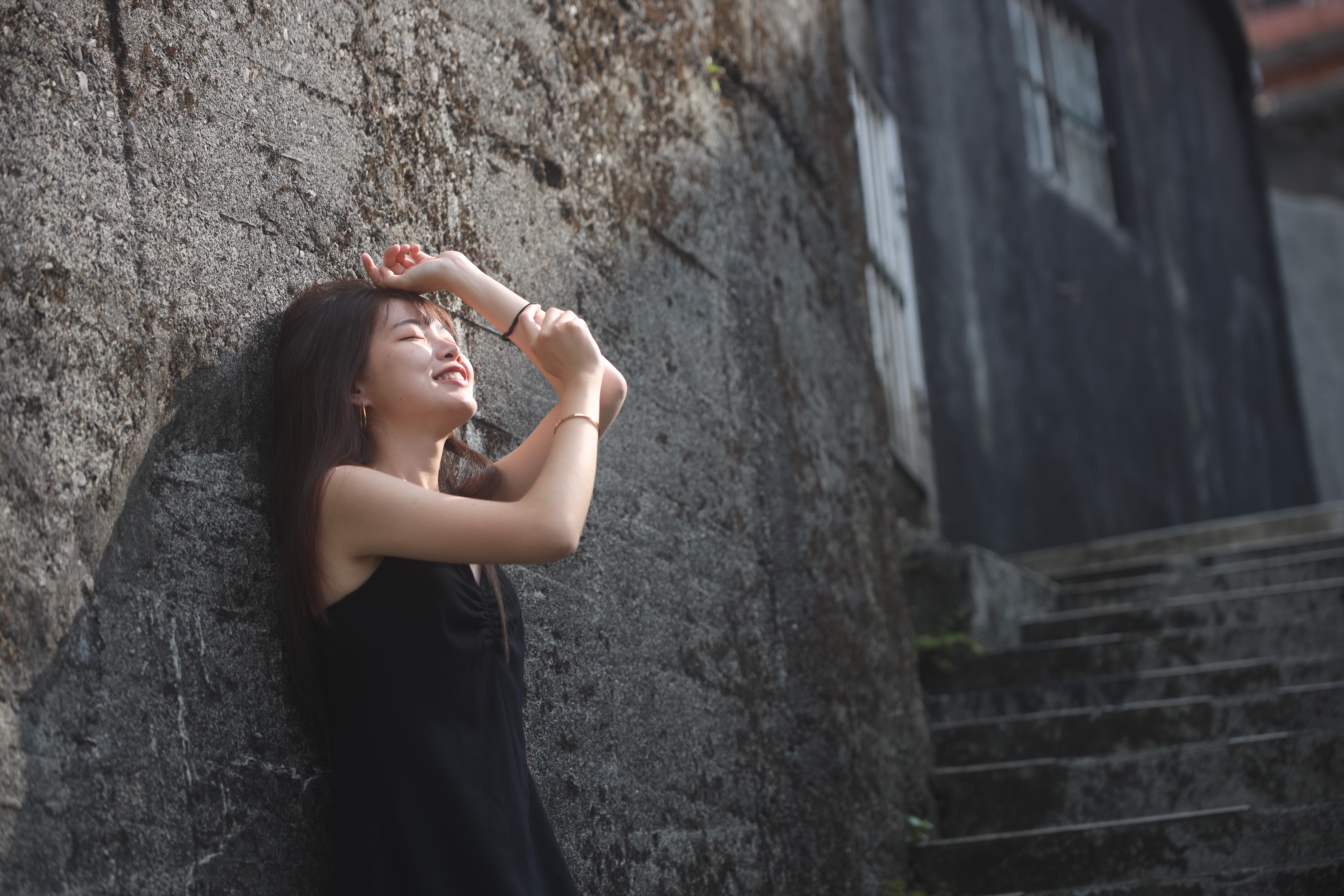 Wan-Ling Chen in a black dress leaning against a stone wall.; Student Recital: Wan-Ling Chen, collaborative piano
