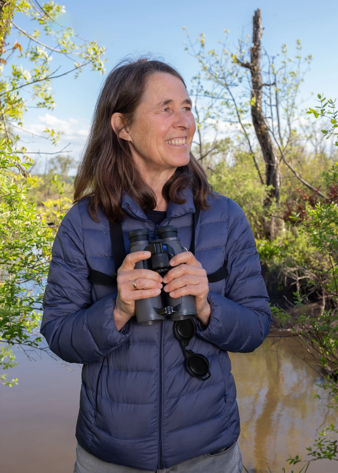Susan Fox Rogers holding binoculars.; A Reading with Susan Fox Rogers