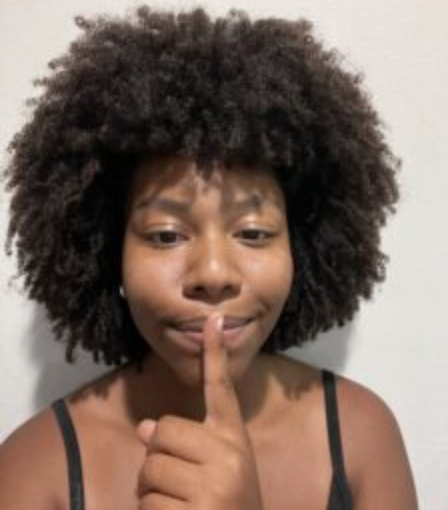 Student making a "shush" gesture. ; Shut Up &amp; Sproj