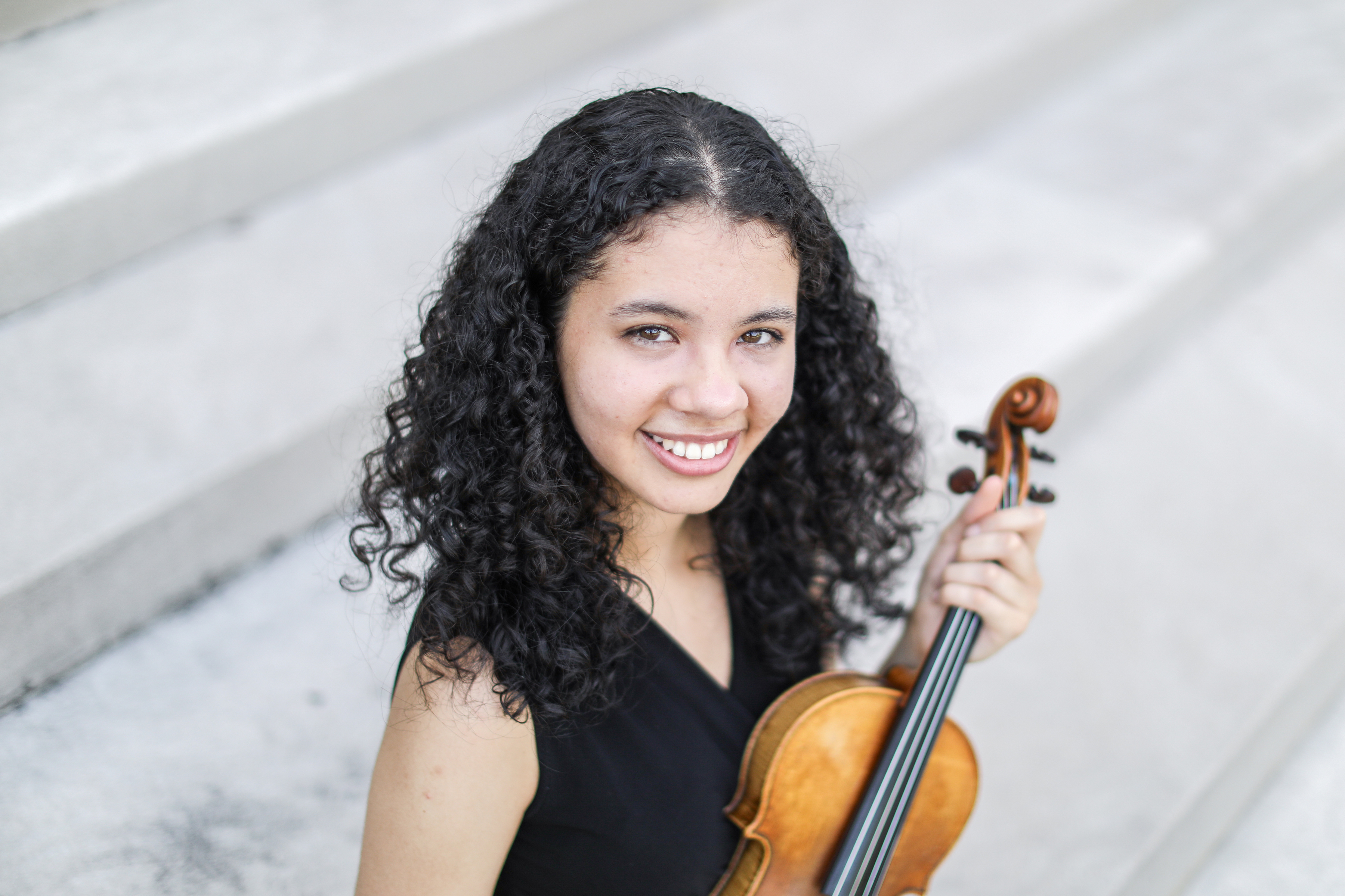 Isabel Chin Garita smiling and holding a violin. ; Undergraudate Degree Recital: Isabel Chin Garita, violin