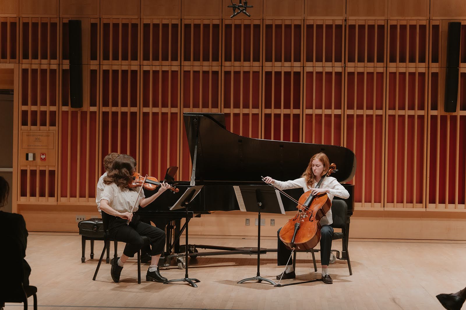 A violinist, cellist, and pianist, performing in a recital hall. ; Chamber Music Marathon - Part II