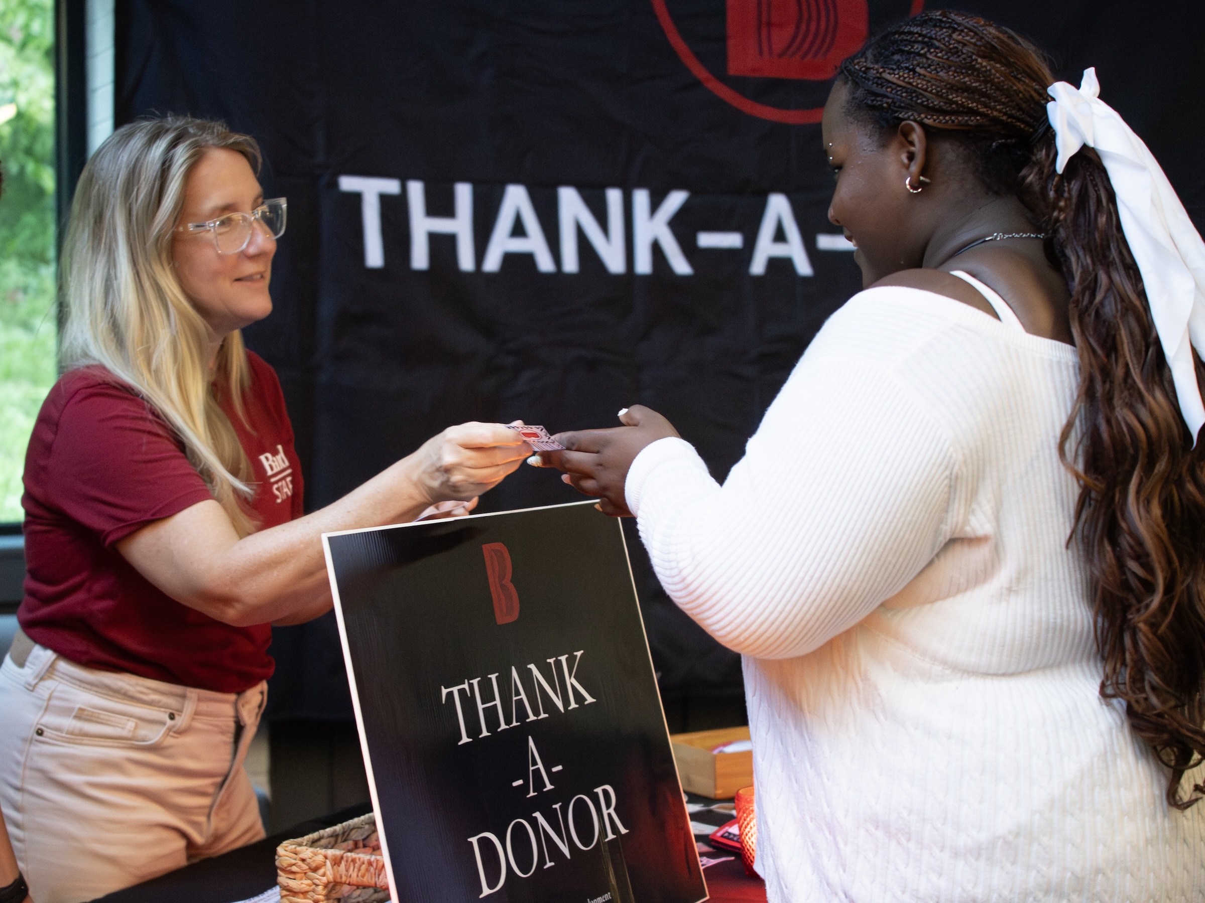 A Bard student is gifted some swag for volunteering at&nbsp;the College's <em>Thank A Donor</em> event on Thursday, August 27, 2026. Photo Credit: Mohamad Allahham '29.