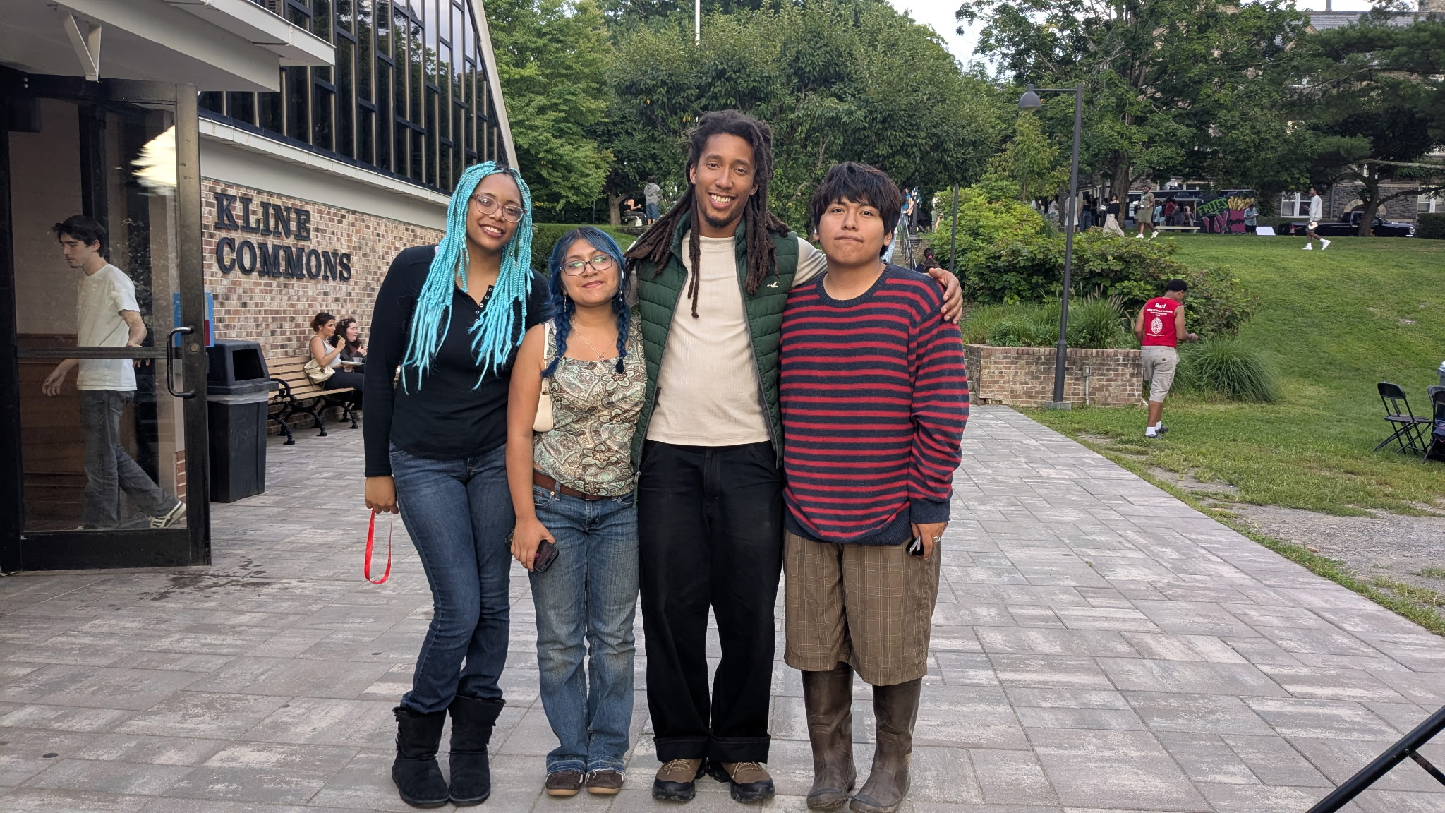 Jeszack Gammon '17 with three of his L&T students at the block party by Kline.*