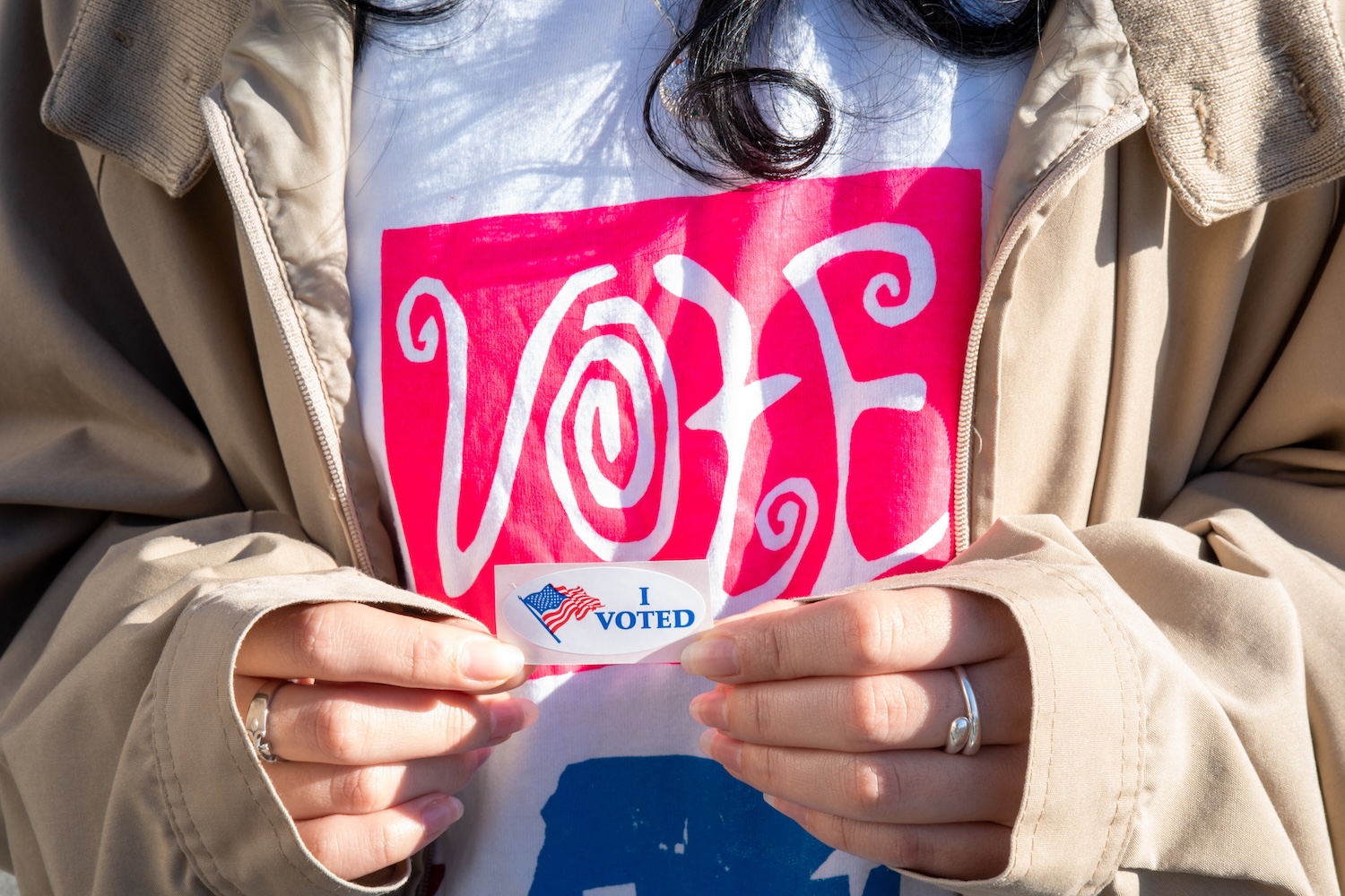 Student holding "I Voted" sticker in her hands on Election Day in 2024 on the Bard College campus.