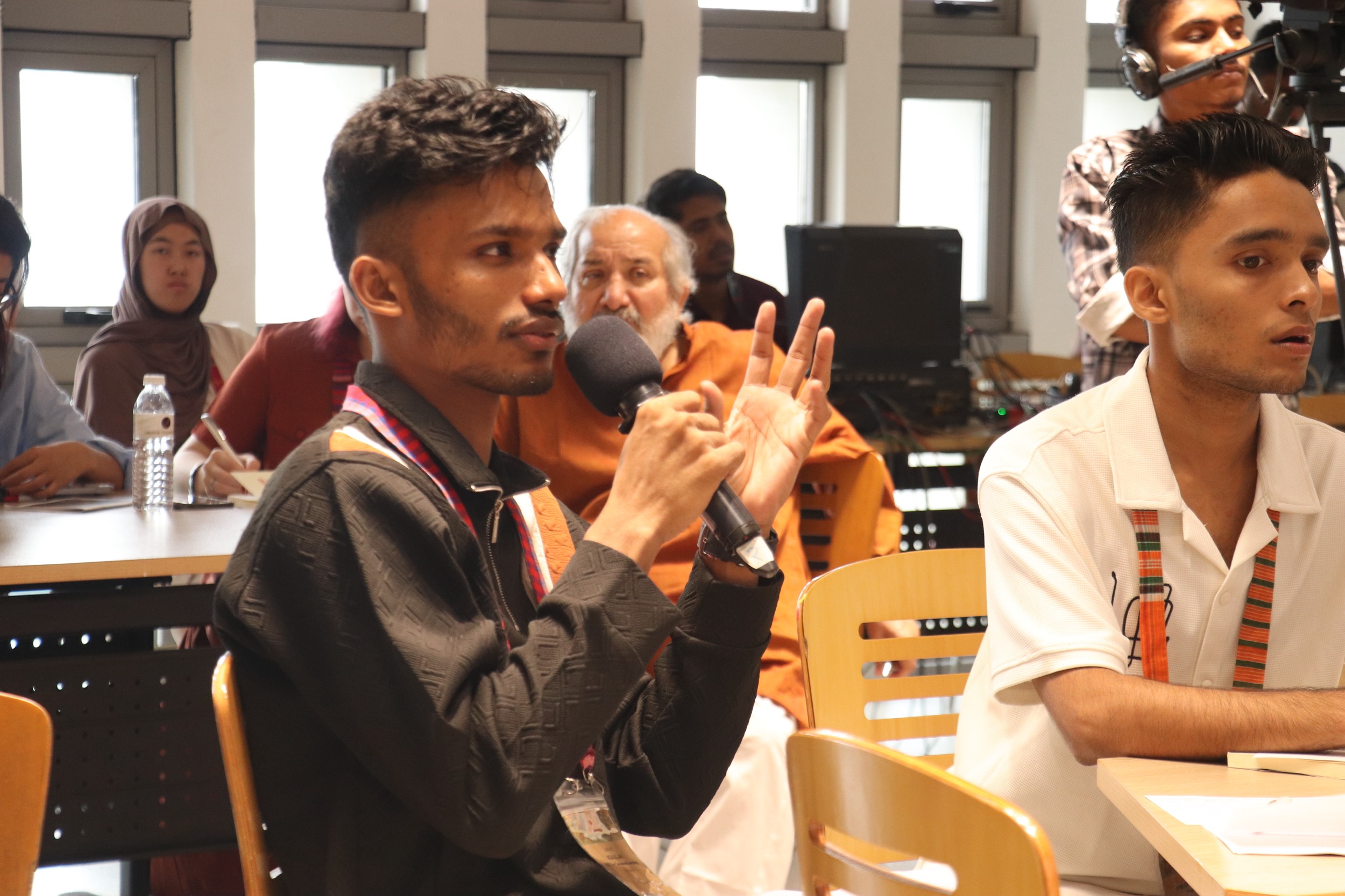 a student speaks in a classroom