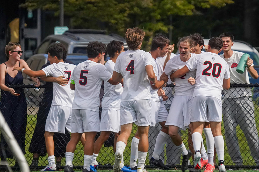 Members of the Bard Men's Soccer Team celebrate a win.