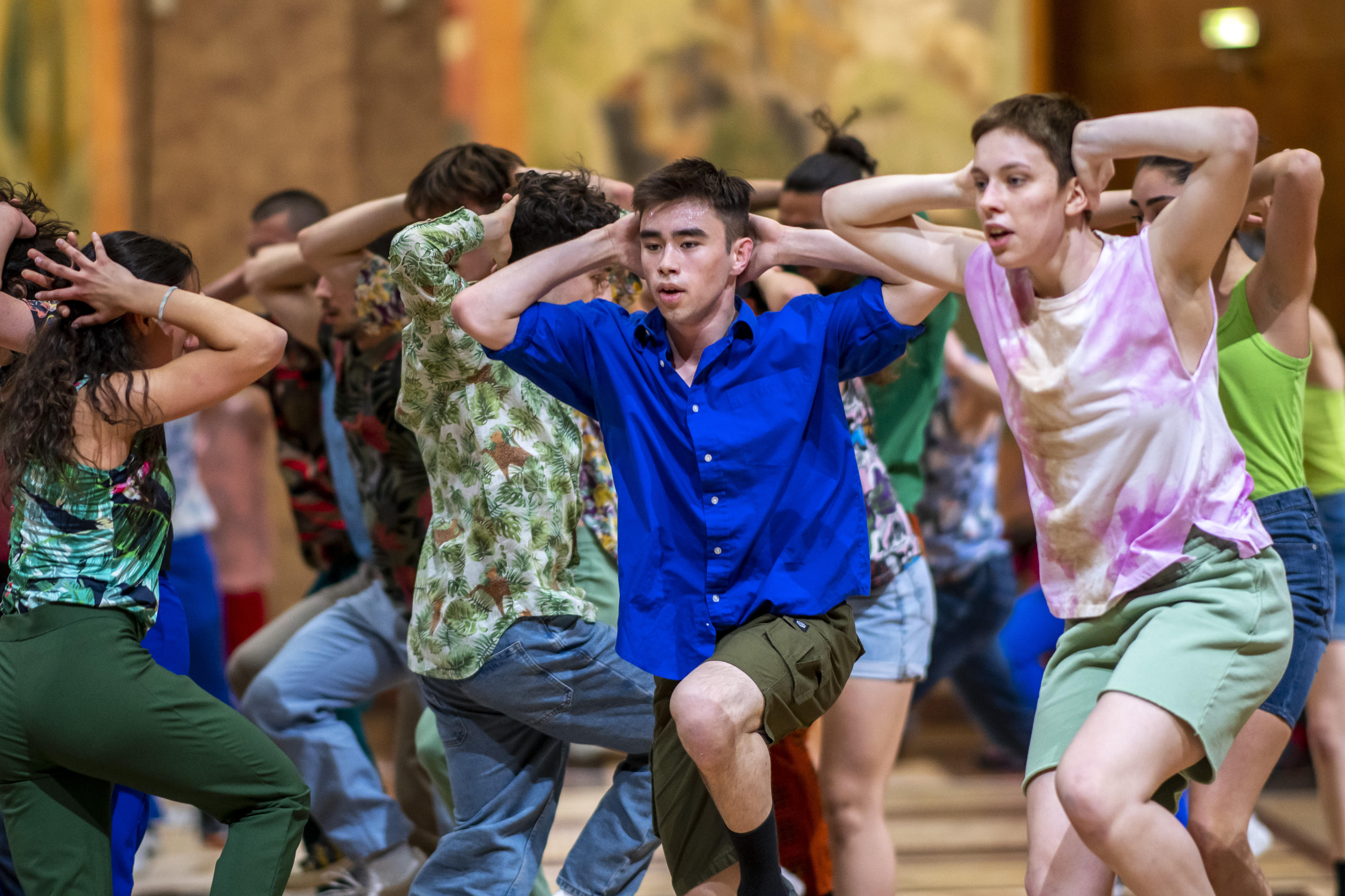 Two dancers in red and green dresses striking a dramatic pose.; Visit https://fishercenter.bard.edu/events/faculty-dance-concert-4/