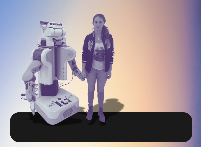 A person standing next to a robot, holding its hand.; Examining Trust in Human-Robot Interaction