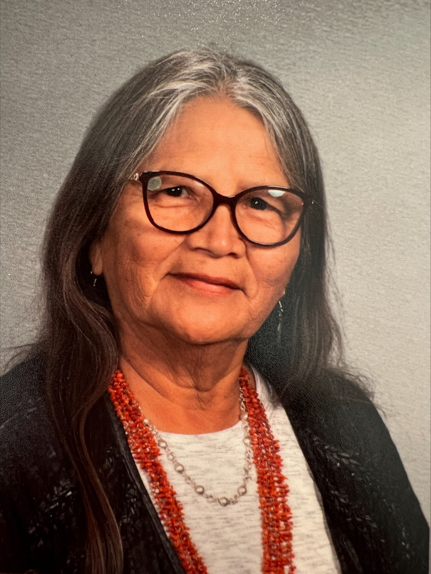 A woman with dark framed glasses and a red, beaded necklace poses for a portrait.; Visit https://ccs.bard.edu/events/897-marilou-schultz
