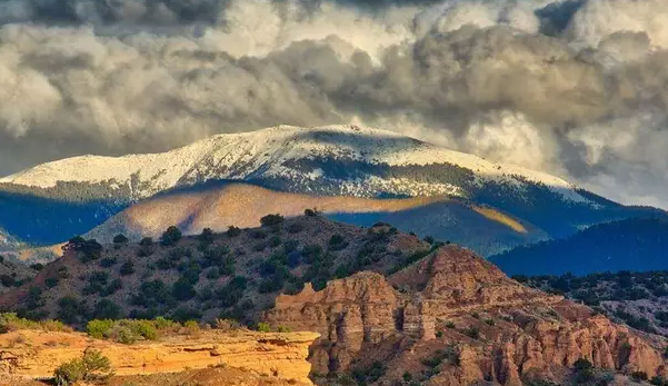 A mountain with clouds over it.; Visit https://bardian.bard.edu/register/sw-arts-25