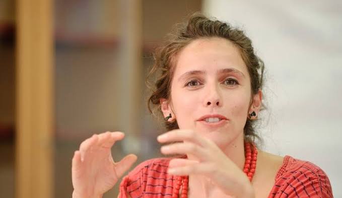 A photo of writer Mar Gómez Glez gesturing with her hands; Mapping Change through the Mushroom Imagination: A Conversation with Mar G&oacute;mez Glez