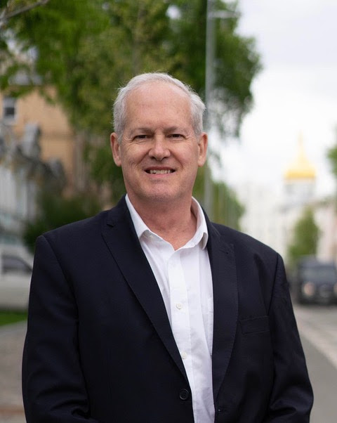James Brooke wearing a white button-down and black blazer.; Visit https://bard.us13.list-manage.com/track/click?u=fddbf92b30524c4db3c05f04c&id=f5cb5614dd&e=8303998b9f