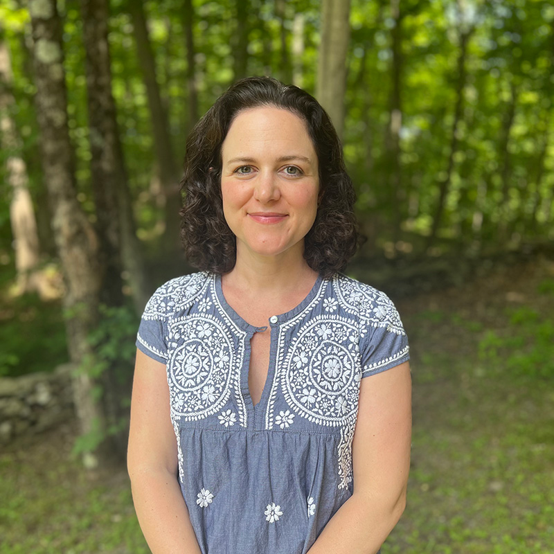 Picture of Ruth Zisman smiling and looking toward the camera.